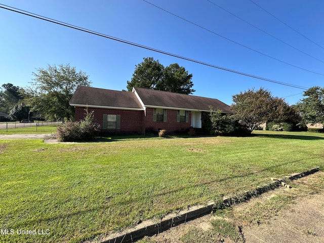 ranch-style home with a front yard