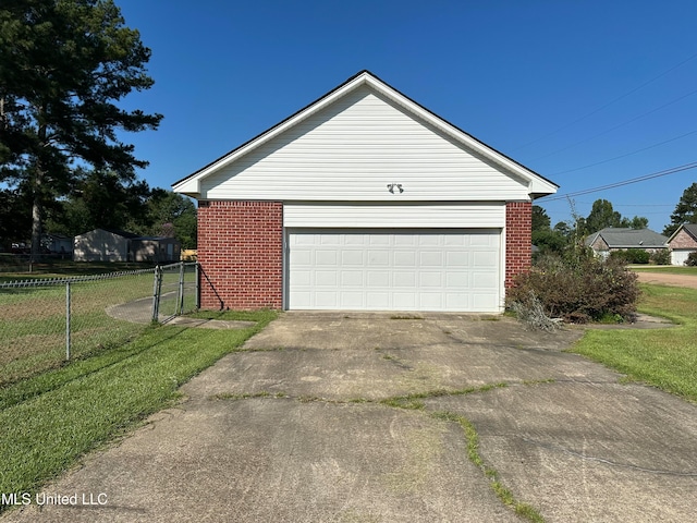 garage featuring a yard