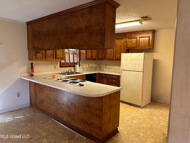 kitchen with white appliances, crown molding, a textured ceiling, and kitchen peninsula