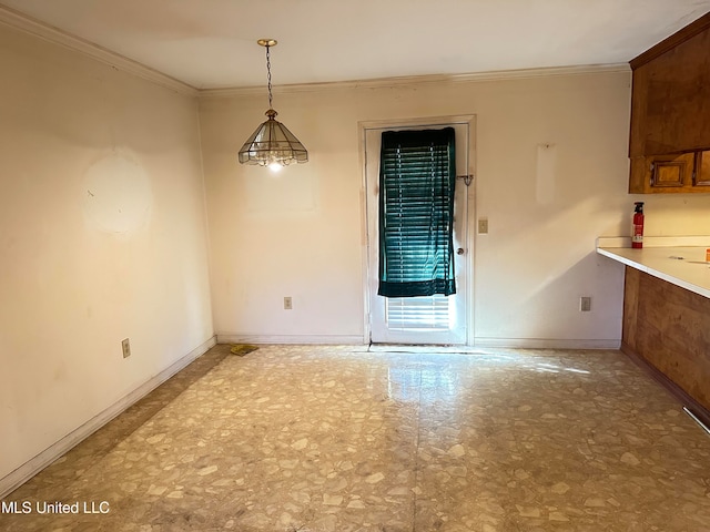 unfurnished dining area with crown molding and a chandelier