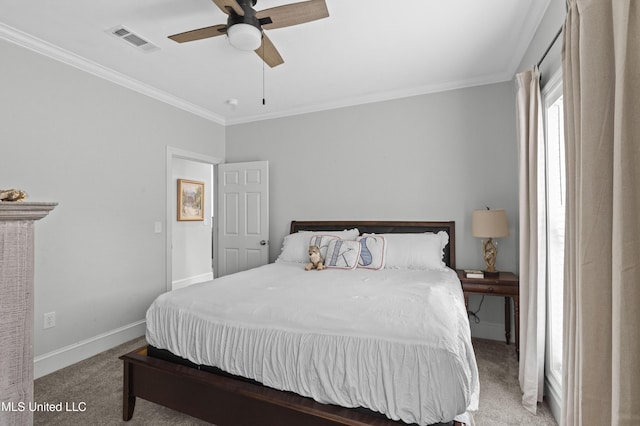 bedroom with baseboards, visible vents, a ceiling fan, ornamental molding, and carpet floors