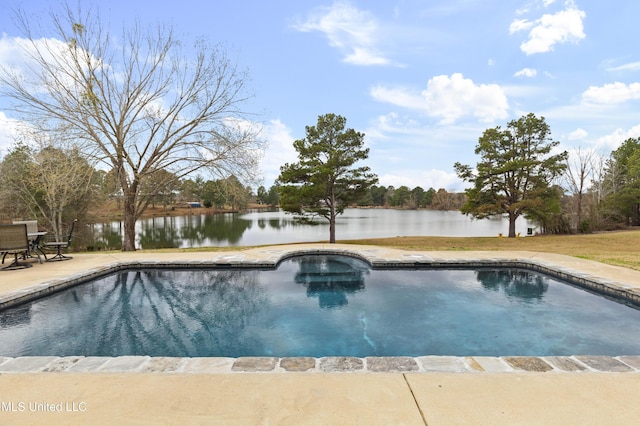 outdoor pool featuring a water view and a patio area