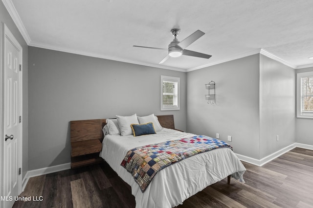 bedroom featuring ornamental molding, a ceiling fan, baseboards, and wood finished floors