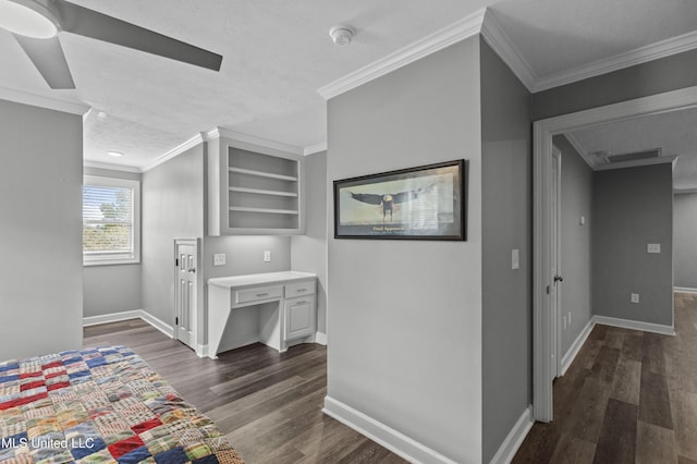 interior space featuring ornamental molding, dark wood-style flooring, visible vents, and baseboards