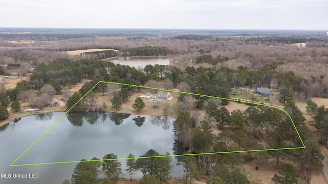 drone / aerial view with a water view and a wooded view