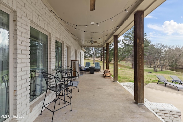 view of patio featuring a ceiling fan