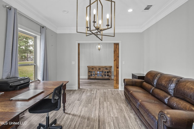 office space with baseboards, visible vents, ornamental molding, and wood finished floors