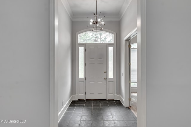 121 Poplar Ridge Dr, Brandon, MS 39047 - entryway featuring ornamental molding, a chandelier, and baseboards