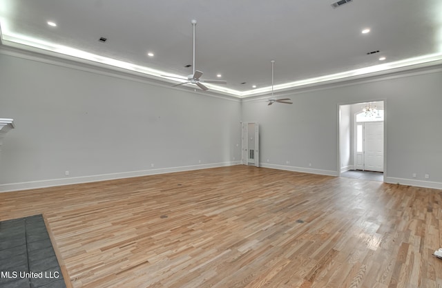 121 Poplar Ridge Dr, Brandon, MS 39047 - spare room with ceiling fan, light wood-style flooring, a tray ceiling, baseboards, and recessed lighting