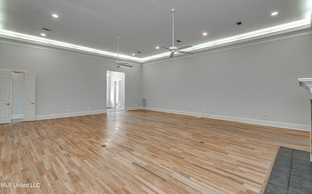 121 Poplar Ridge Dr, Brandon, MS 39047 - empty room featuring ceiling fan, light wood-type flooring, baseboards, recessed lighting, and a tray ceiling