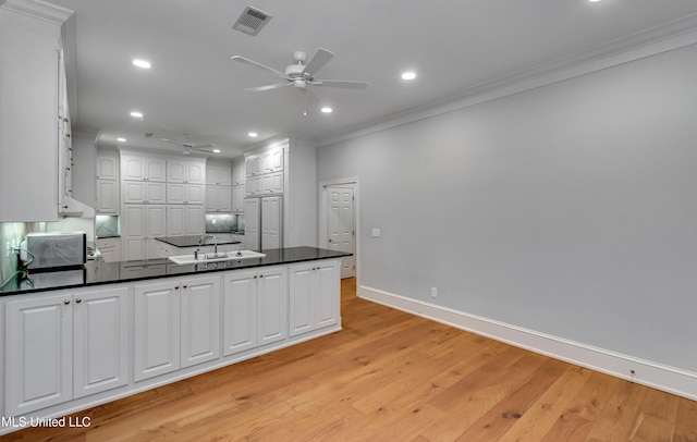 121 Poplar Ridge Dr, Brandon, MS 39047 - kitchen with ceiling fan, crown molding, dark countertops, baseboards, and recessed lighting