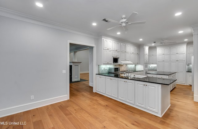 121 Poplar Ridge Dr, Brandon, MS 39047 - kitchen featuring ceiling fan, ornamental molding, dark countertops, white cabinets, and recessed lighting