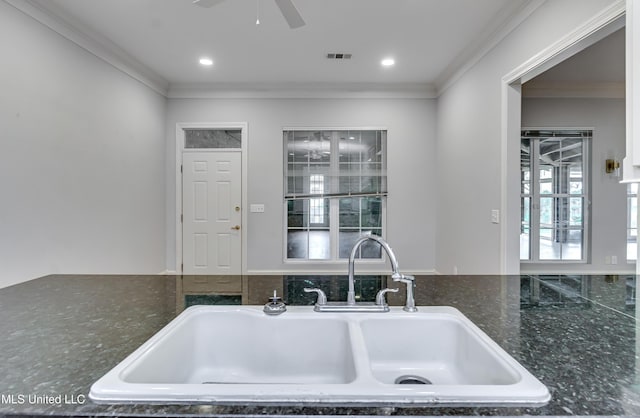 121 Poplar Ridge Dr, Brandon, MS 39047 - kitchen with a sink, crown molding, ceiling fan, recessed lighting, and dark stone counters