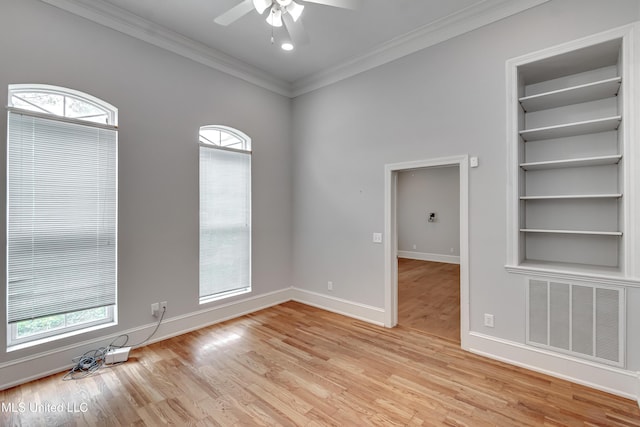 121 Poplar Ridge Dr, Brandon, MS 39047 - empty room featuring ornamental molding, ceiling fan, baseboards, built in features, and light wood-style flooring