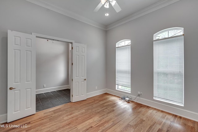 121 Poplar Ridge Dr, Brandon, MS 39047 - unfurnished room featuring crown molding, a ceiling fan, light wood-style flooring, plenty of natural light, and baseboards
