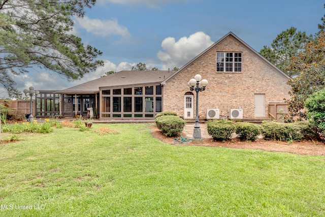 121 Poplar Ridge Dr, Brandon, MS 39047 - rear view of house with a sunroom, a cooling unit, and brick siding
