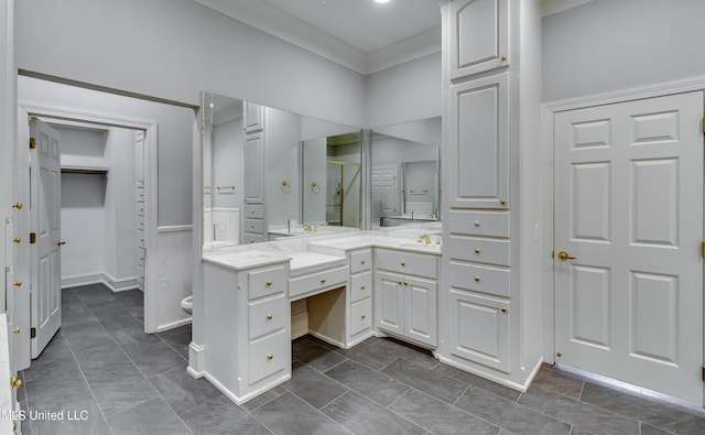 121 Poplar Ridge Dr, Brandon, MS 39047 - bathroom with vanity, a closet, a shower with door, baseboards, and ornamental molding