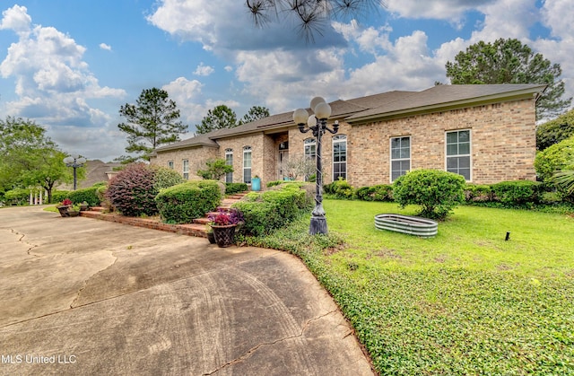 121 Poplar Ridge Dr, Brandon, MS 39047 - view of front of property with a front yard and brick siding