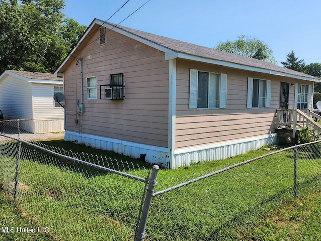 view of property exterior with a lawn