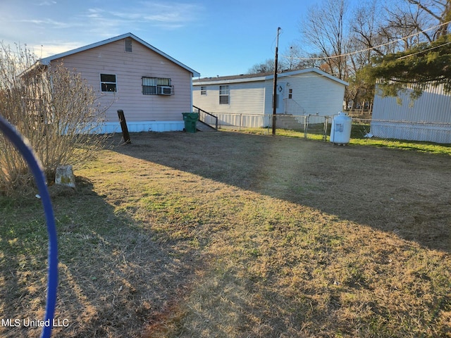 44 E E St, Cruger, MS 38924 - rear view of property featuring a yard