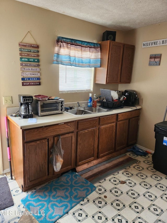 44 E E St, Cruger, MS 38924 - kitchen with a textured ceiling and sink