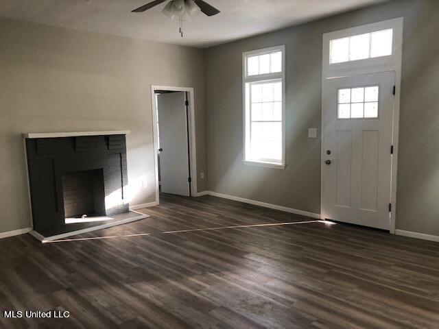 foyer entrance featuring ceiling fan and dark hardwood / wood-style flooring