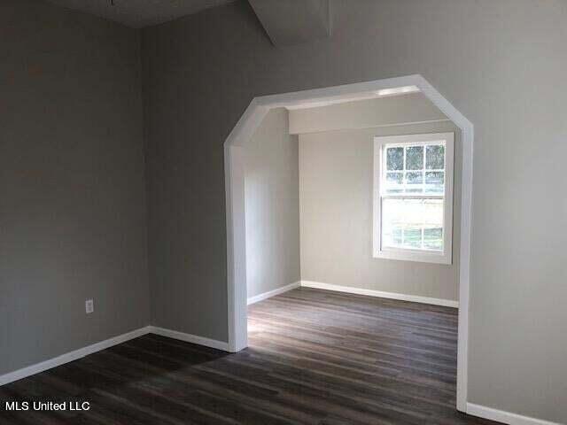 bonus room featuring dark wood-type flooring