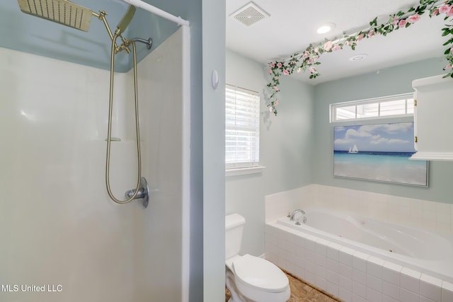bathroom with a shower, toilet, and a bath