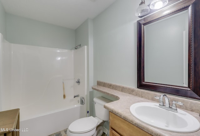 bathroom featuring vanity, toilet, and bathing tub / shower combination