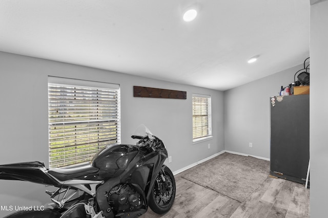 interior space featuring wood finished floors and baseboards