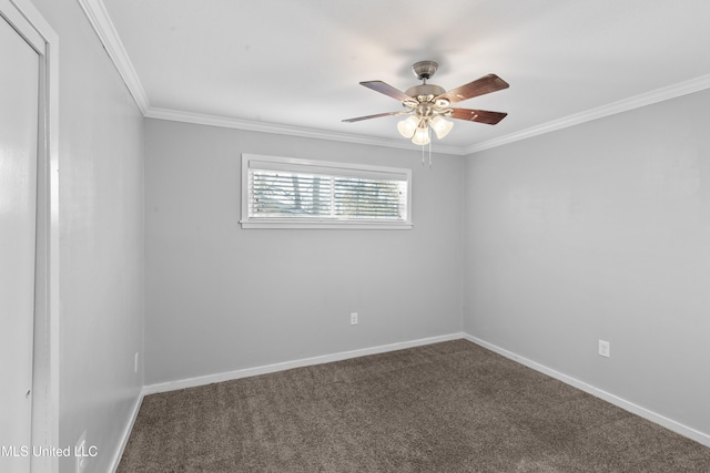 spare room with a ceiling fan, carpet, ornamental molding, and baseboards