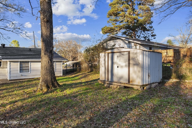 view of shed with fence