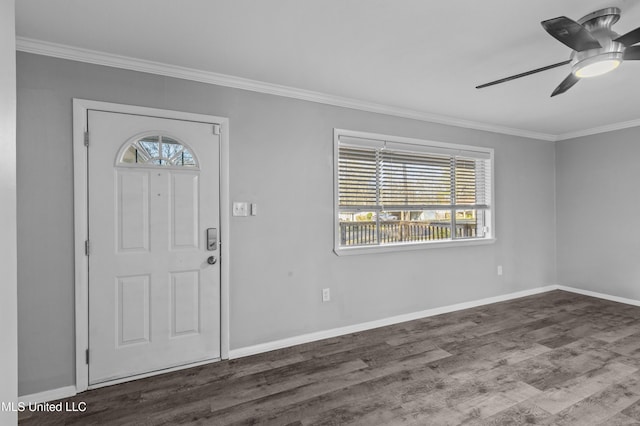 foyer with crown molding, baseboards, and wood finished floors