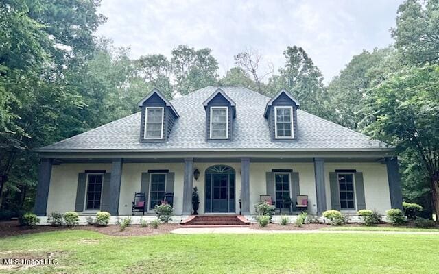 view of front of house featuring a front yard and covered porch