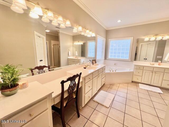 bathroom featuring vanity, ornamental molding, tile patterned floors, and separate shower and tub