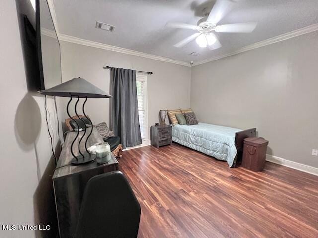 bedroom featuring dark hardwood / wood-style flooring, crown molding, and ceiling fan