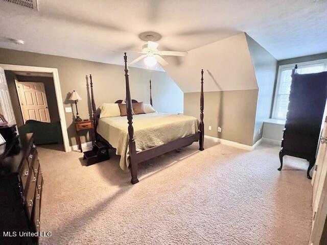 bedroom featuring light colored carpet and ceiling fan