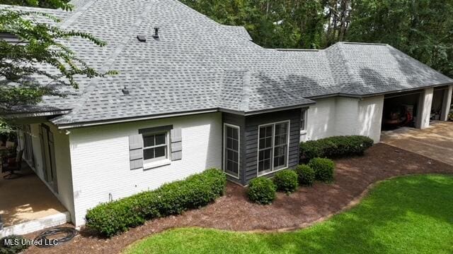 view of side of home with a garage