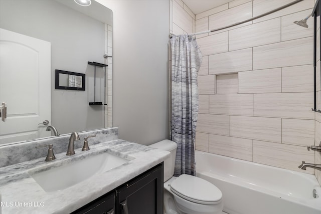 bathroom with vanity, toilet, and shower / bath combo