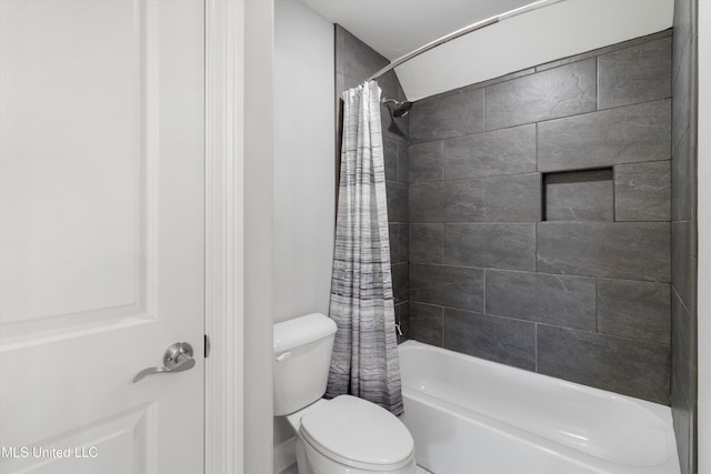 bathroom with toilet and shower / tub combo with curtain