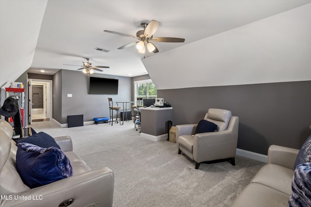 carpeted living area with vaulted ceiling, baseboards, a ceiling fan, and visible vents