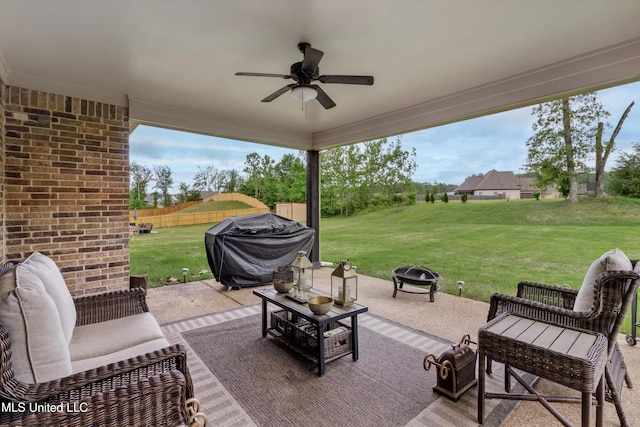 view of patio featuring an outdoor living space with a fire pit, grilling area, fence, and a ceiling fan