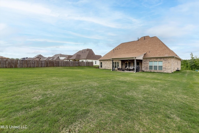 view of yard featuring a patio and fence