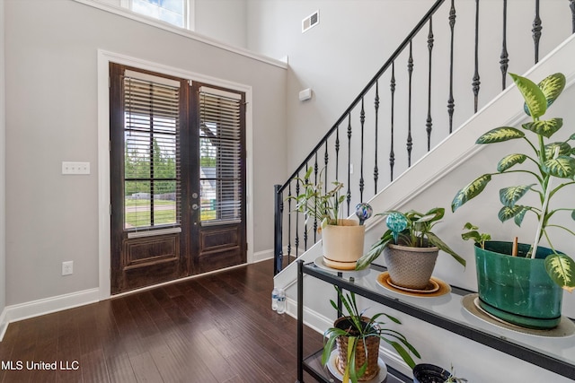 entryway with plenty of natural light, french doors, and stairs