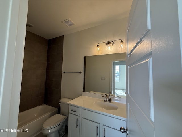 bathroom with  shower combination, visible vents, vanity, and toilet