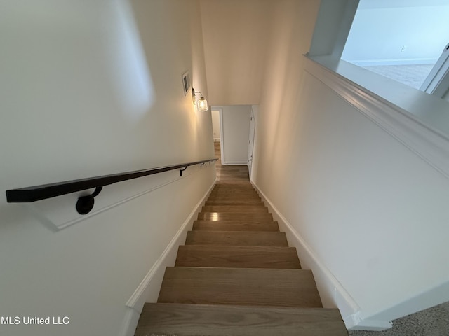 staircase featuring visible vents and baseboards