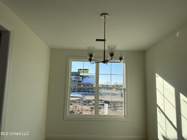 interior details with an inviting chandelier