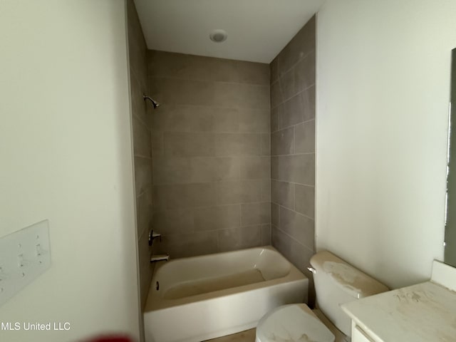 full bathroom with bathing tub / shower combination, vanity, and toilet