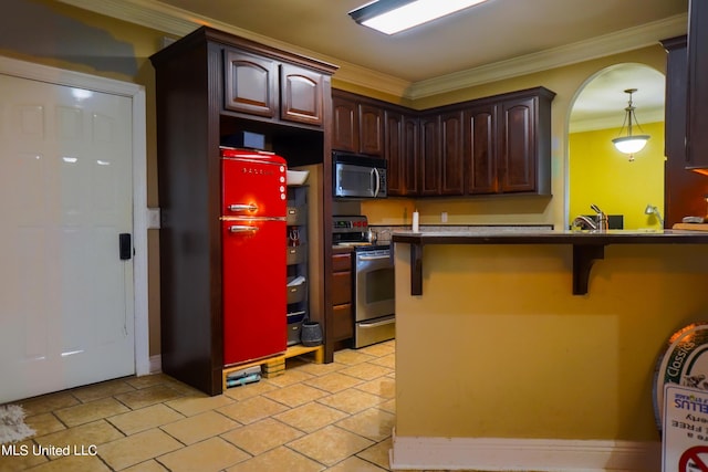 kitchen featuring a kitchen breakfast bar, crown molding, arched walkways, dark brown cabinetry, and appliances with stainless steel finishes
