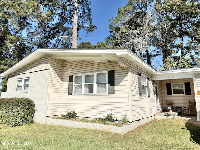 5064 Old Canton Rd, Jackson, MS 39211 - view of property exterior featuring a lawn